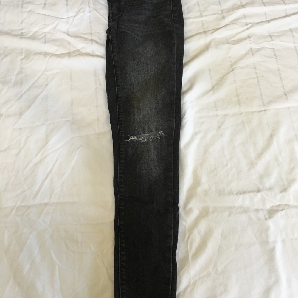 Black knee ripped jeans
